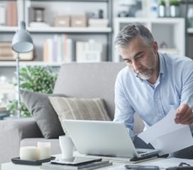Businessman checking bills Businessman checking bills